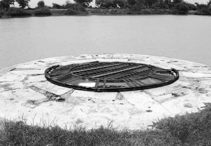 Integrated Solution for Rural Drinking Water Challenges - drinking water well recharged by an adjoining pond in a fluoride-affected village in Patan district, Gujarat